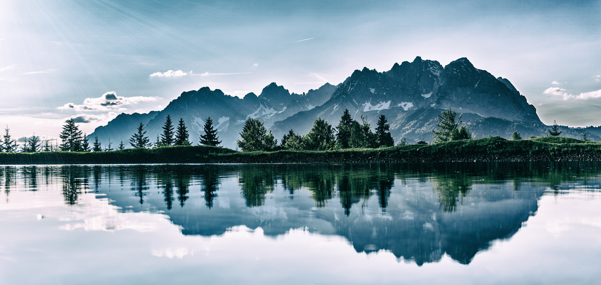 Mountain range reflected in still water